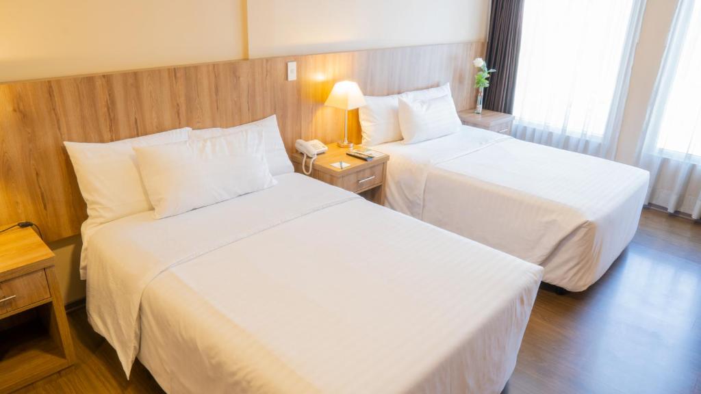 Postel nebo postele na pokoji v ubytování Fenix Hotel