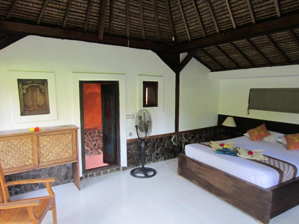 Postel nebo postele na pokoji v ubytování Gili Hideaway
