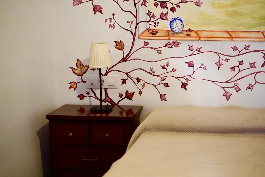 Postel nebo postele na pokoji v ubytování Destino Deluxe Plaza De Santiago - 2 hab