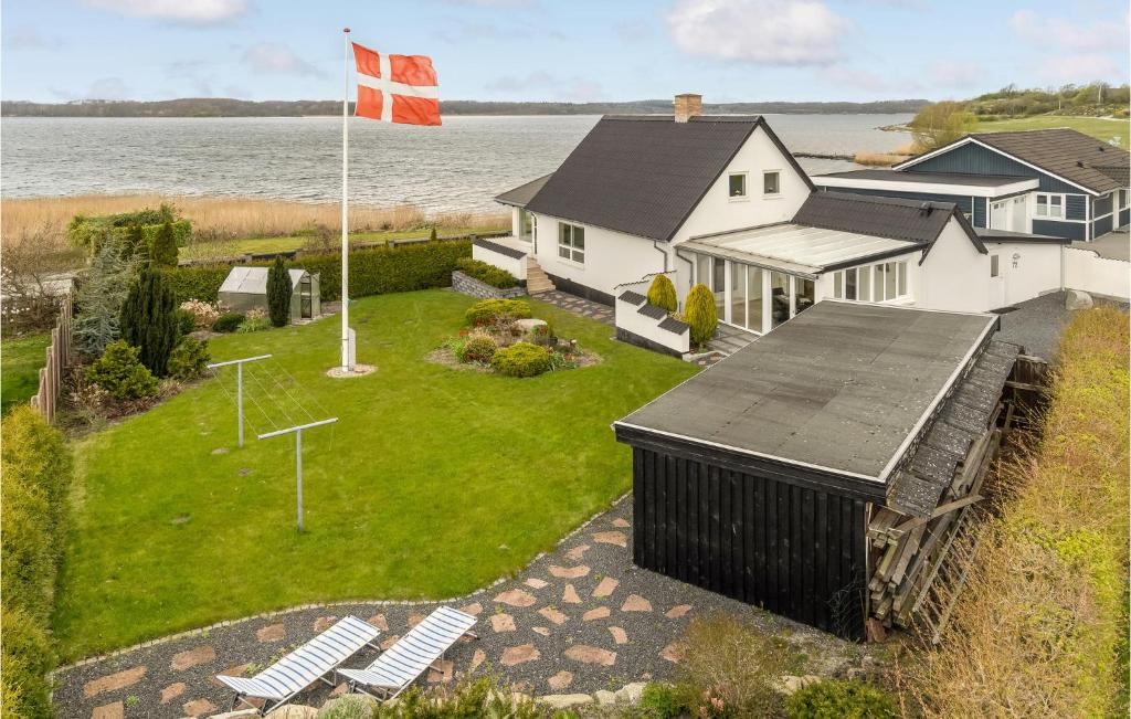 an aerial view of a house with a flag at Beautiful Home In Mariager With Kitchen in Mariager