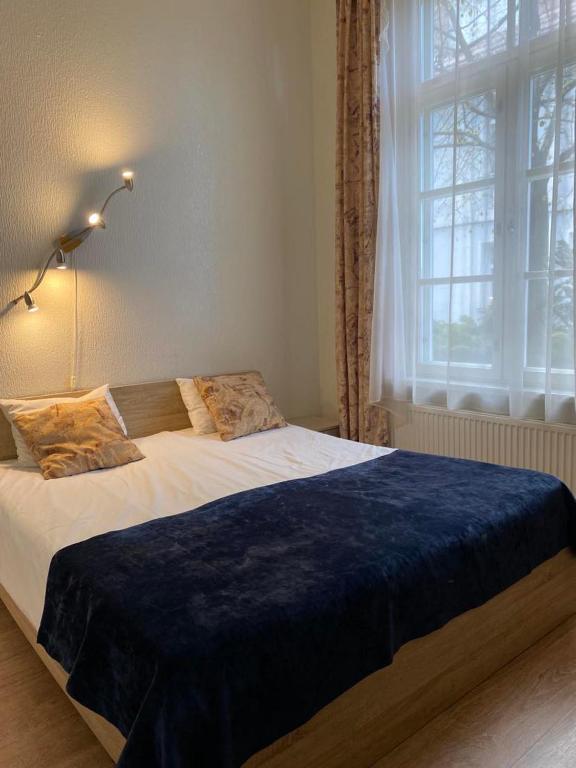 Postel nebo postele na pokoji v ubytování Aquamarine Hotel - Lauluväljak