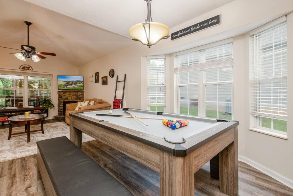 a living room with a pool table in it at Great Smoky Mountain Get-Away in Pigeon Forge