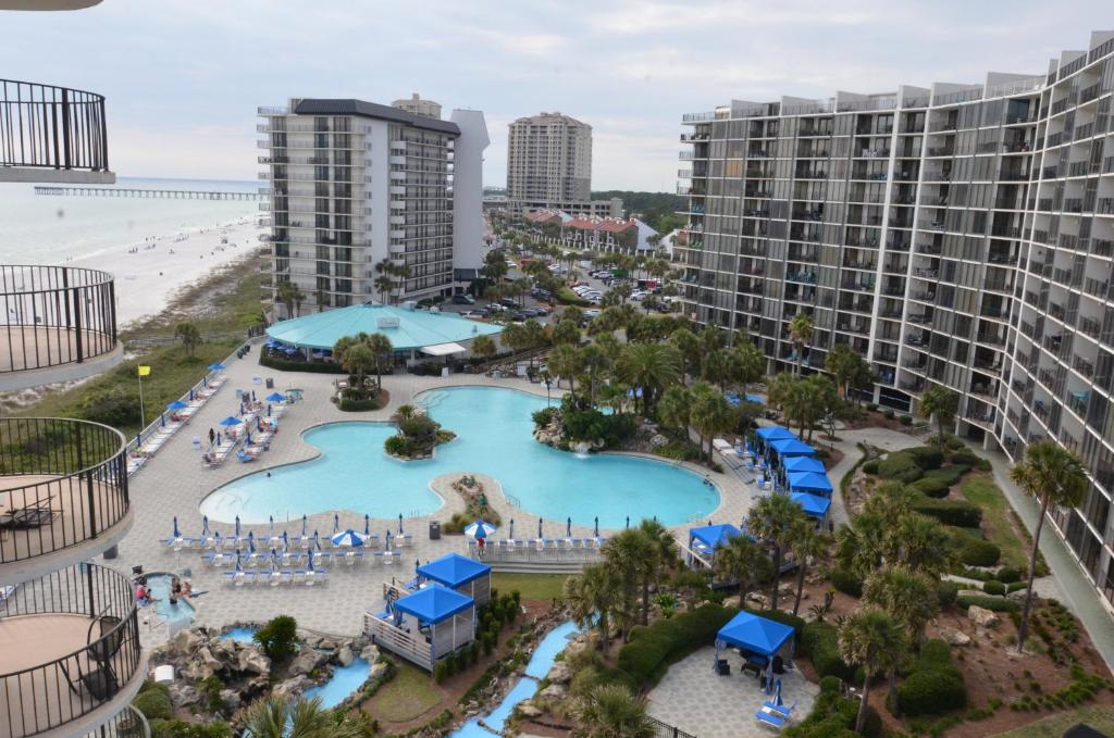 an aerial view of a resort with a pool and the beach at Gulf front condo in Panama City Beach
