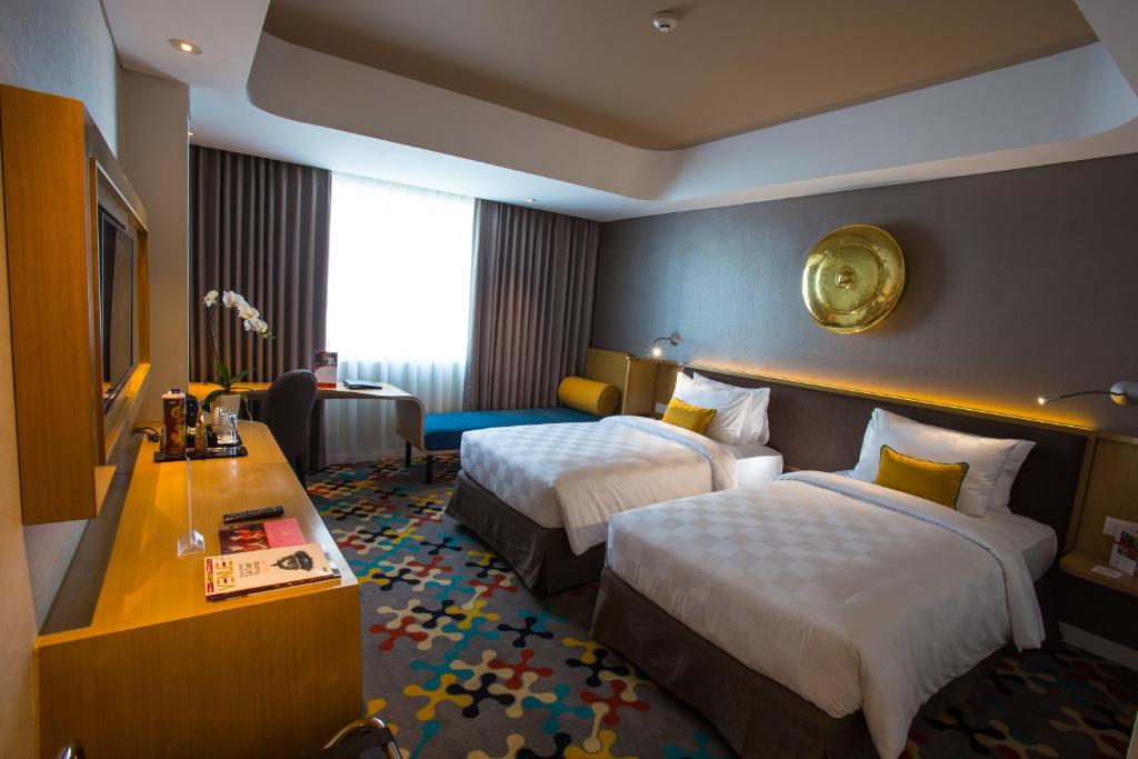 Katil atau katil-katil dalam bilik di Hotel Ciputra Cibubur managed by Swiss-Belhotel International