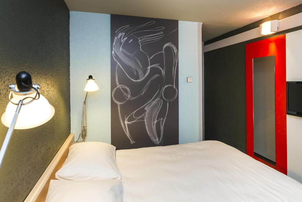 Postel nebo postele na pokoji v ubytování ibis Lorient Centre Hôtelier