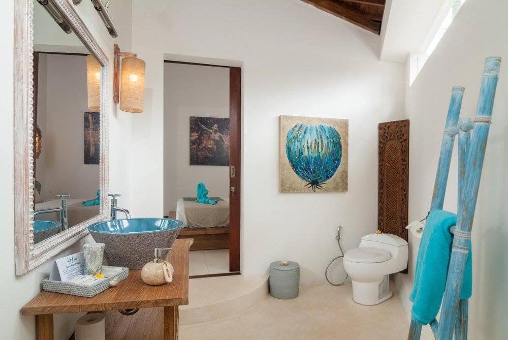 Koupelna v ubytování De'Coco Bungalows