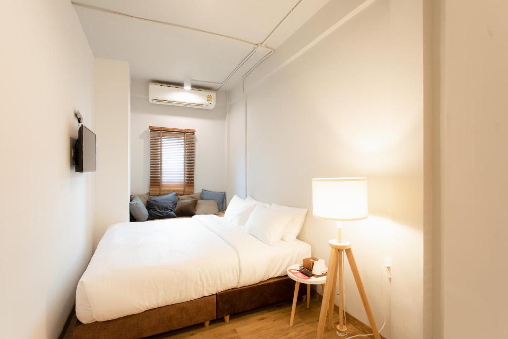 Postel nebo postele na pokoji v ubytování Hotel PAPA Bangkok Siriraj