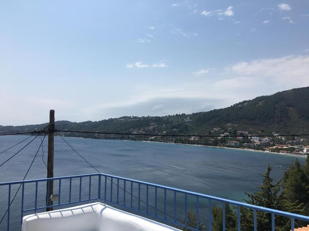 a balcony with a view of a river at The Captain's House in Skiathos Town