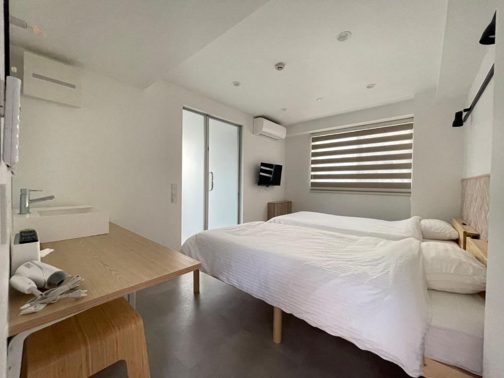 Postel nebo postele na pokoji v ubytování Hotel Apreton