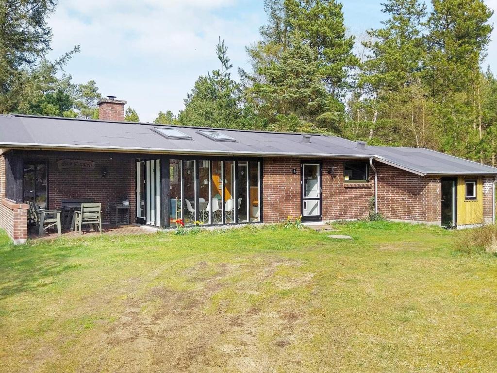 a brick house with a solar roof on a yard at 6 person holiday home in N rre Nebel in Lønne Hede