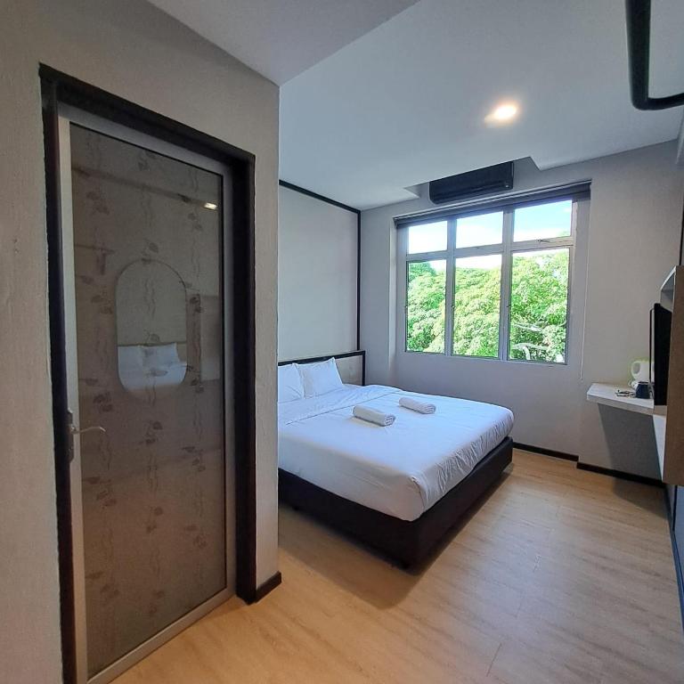 Postel nebo postele na pokoji v ubytování C Hotel