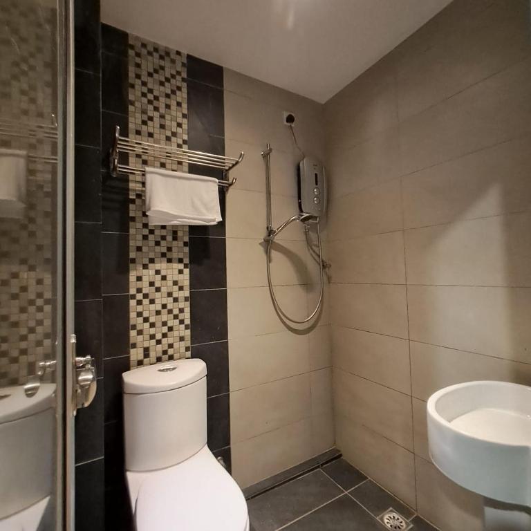 Koupelna v ubytování C Hotel