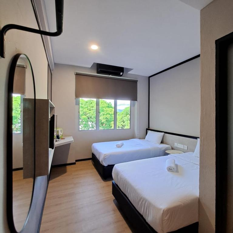 Postel nebo postele na pokoji v ubytování C Hotel