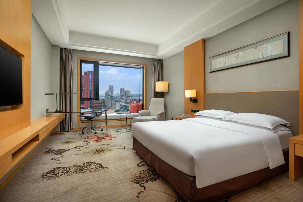 Postel nebo postele na pokoji v ubytování Wyndham Shanghai Nanxiang