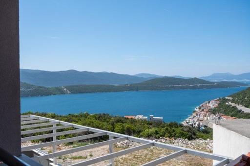 a view of a body of water from a balcony at Nikola,Villa Vuletic in Neum