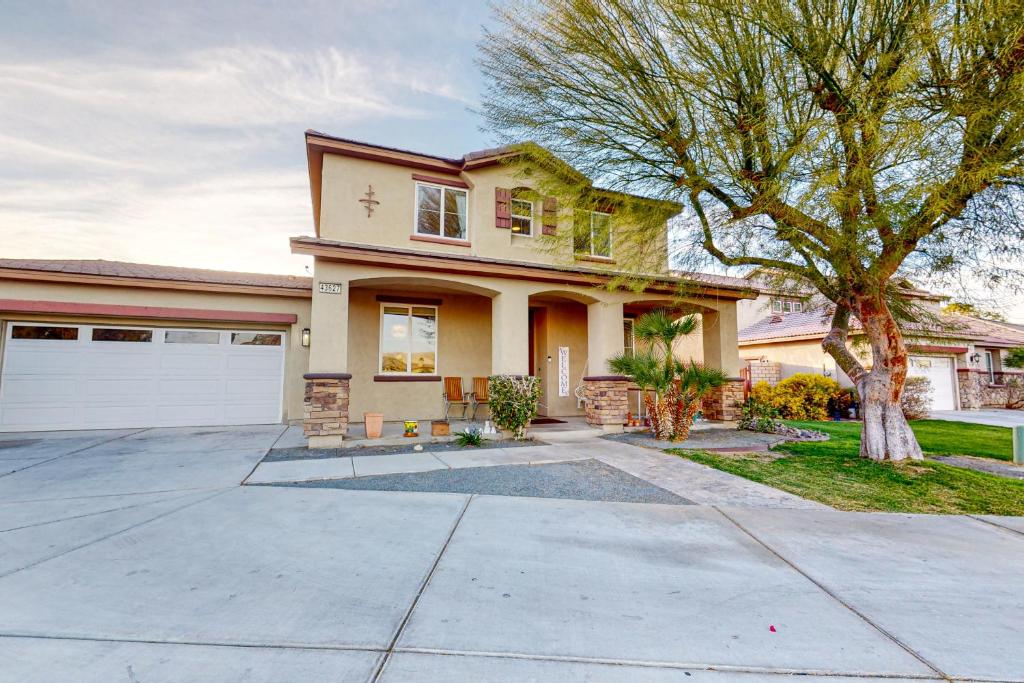 a large house with a driveway in front of it at Festival and Family Fun Permit# 50369 in Indio