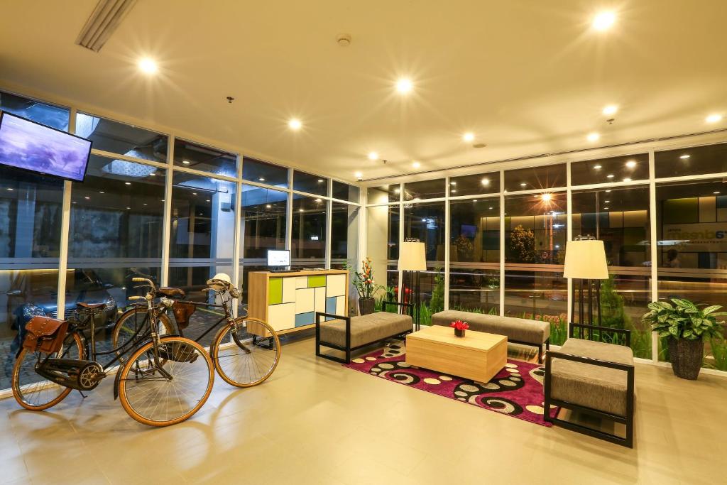 a room with two bikes parked in a building at Hotel Citradream Tugu Yogyakarta in Yogyakarta