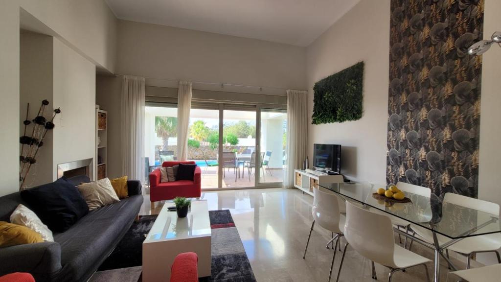 A television and/or entertainment centre at Villa Golf Las Colinas