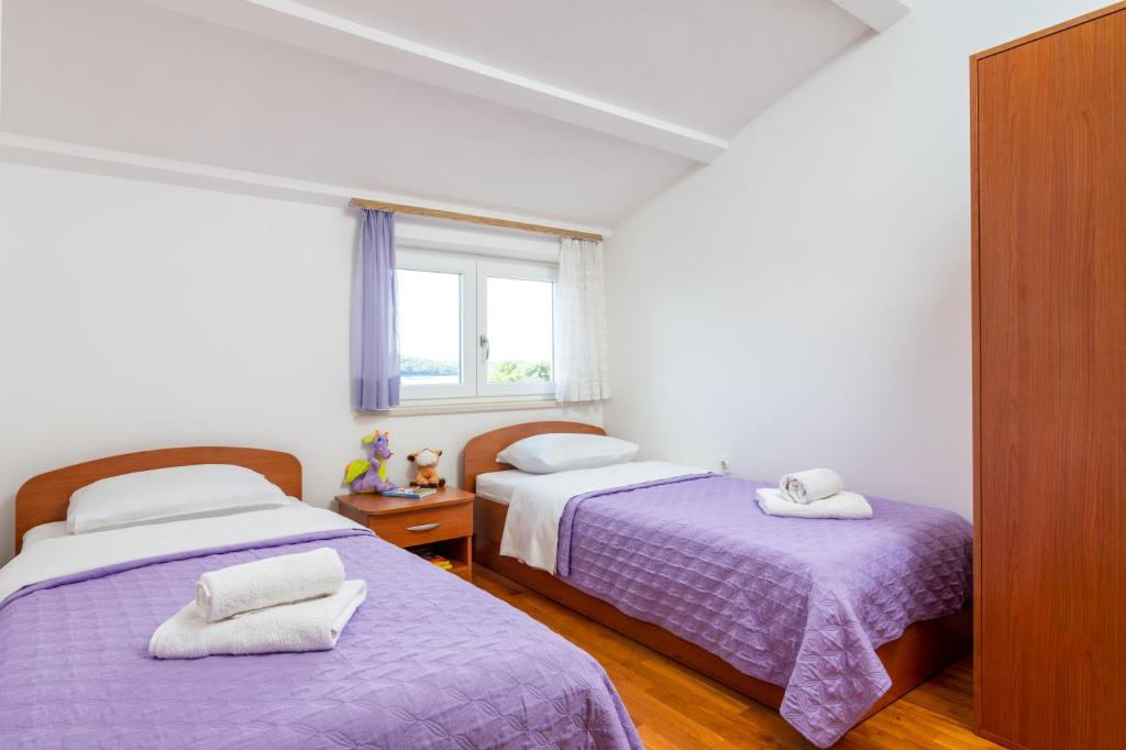 Postel nebo postele na pokoji v ubytování Apartment Medulin 2274a