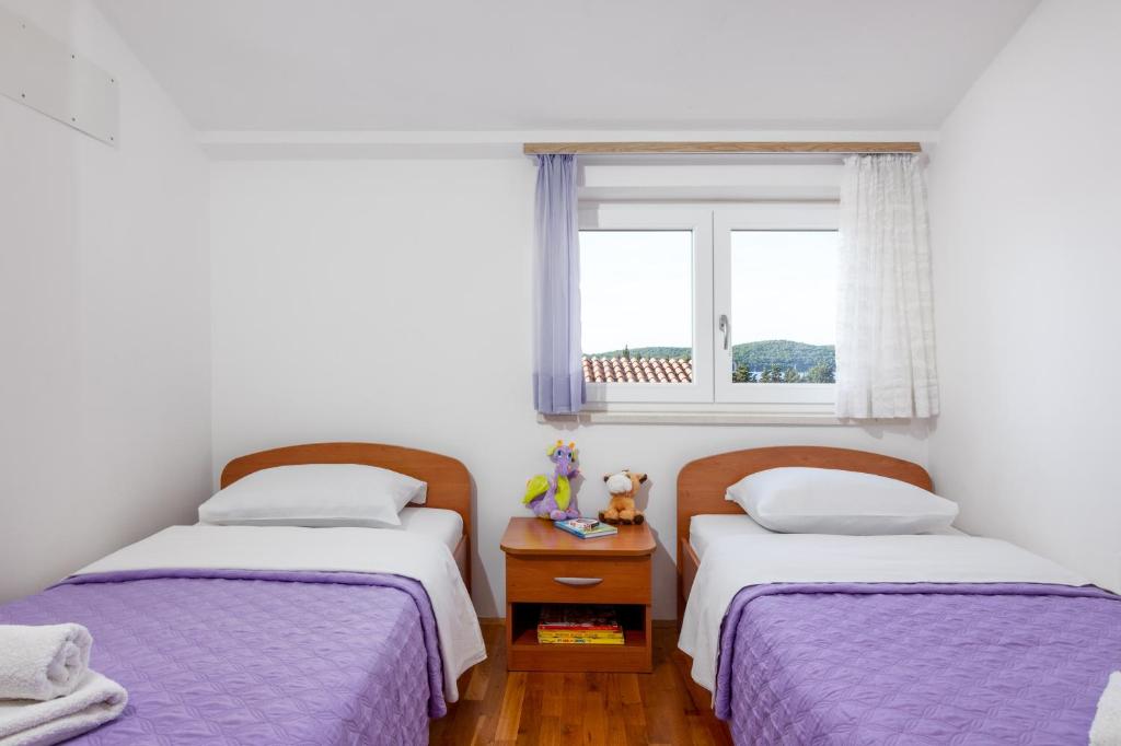 Postel nebo postele na pokoji v ubytování Apartment Medulin 2274a