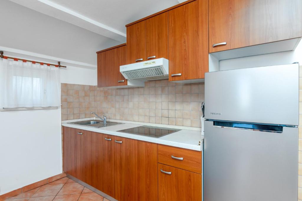 Kuchyň nebo kuchyňský kout v ubytování Apartment Medulin 2274a