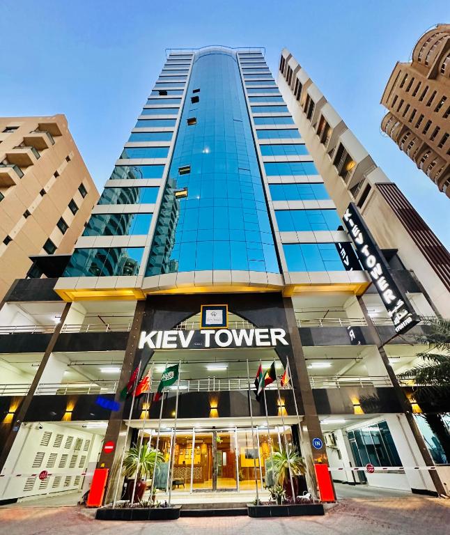 a large building with a key tower at Kiev Tower Hotel Apartments in Manama