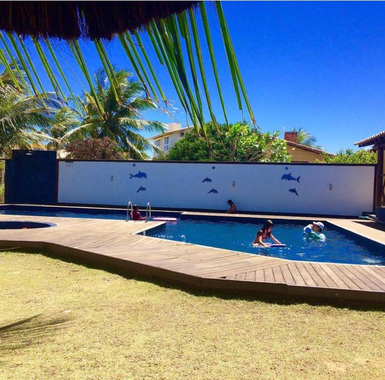 Bazén v ubytování Vilagge PÉ NA AREIA - Itacimirim Bahia nebo v jeho okolí