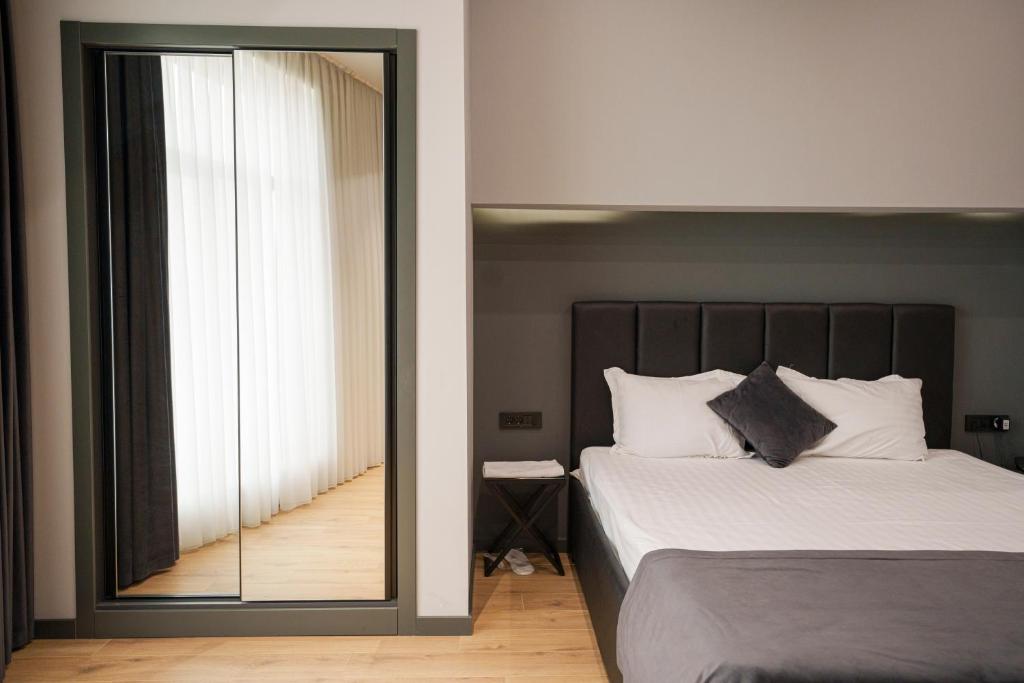 Postel nebo postele na pokoji v ubytování Hotel Elion