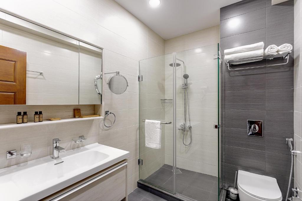 Koupelna v ubytování Vinum Hotel