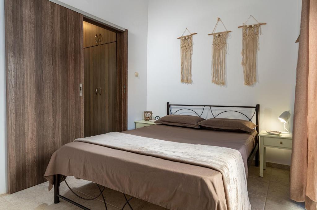 En eller flere senge i et værelse på Appartamento Mare calmo-Myrtos