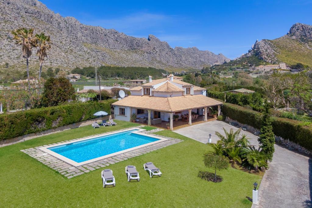 an aerial view of a house with a swimming pool at Villa Eu Figueral by JS Villas in Port de Pollensa