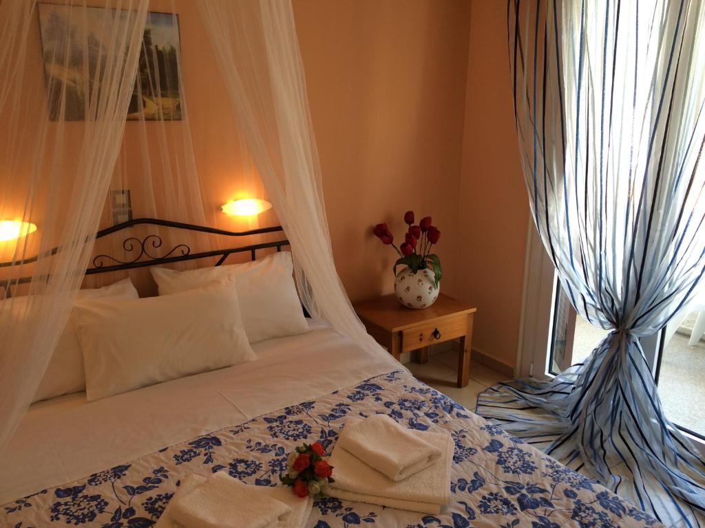 Postel nebo postele na pokoji v ubytování Isidora Hotel