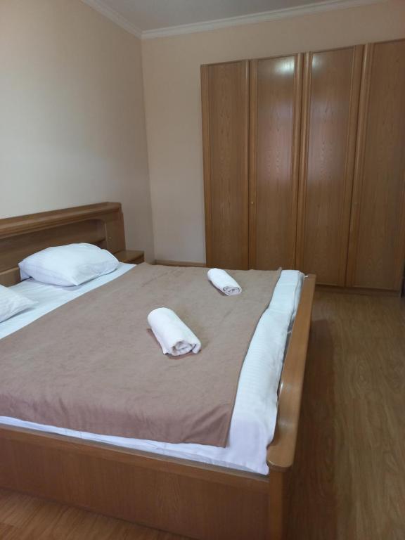 Postel nebo postele na pokoji v ubytování Guest House IRAKLI