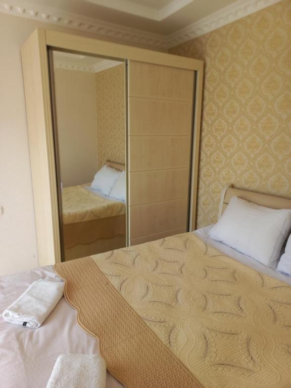 Postel nebo postele na pokoji v ubytování Guest House IRAKLI