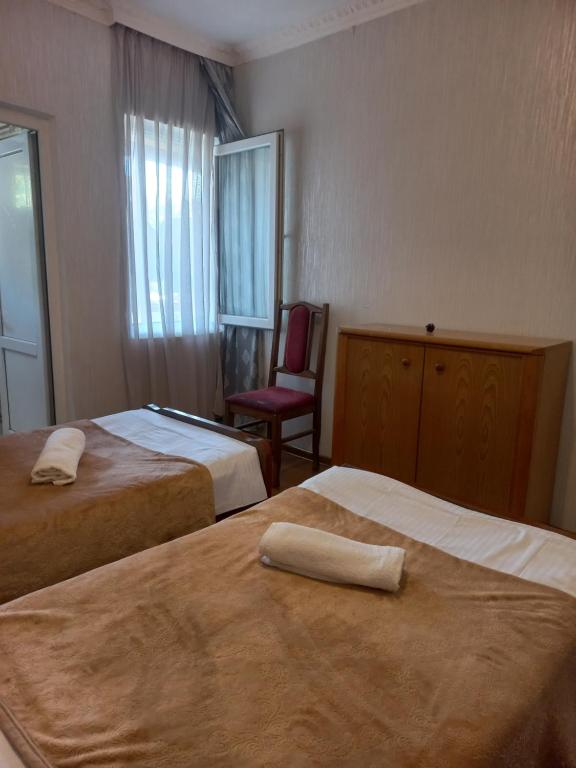 Postel nebo postele na pokoji v ubytování Guest House IRAKLI