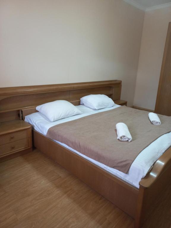 Postel nebo postele na pokoji v ubytování Guest House IRAKLI