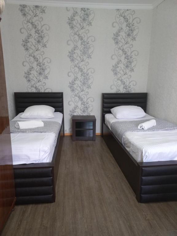 Postel nebo postele na pokoji v ubytování Guest House IRAKLI