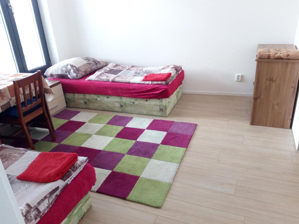 Postel nebo postele na pokoji v ubytování Penzion Apartmány Zlín