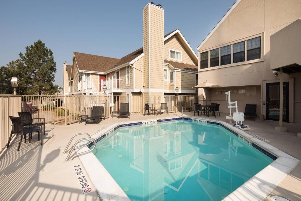 a swimming pool in front of a house at Residence Inn Denver Downtown in Denver