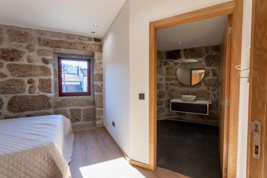 Postel nebo postele na pokoji v ubytování Carvalho Village