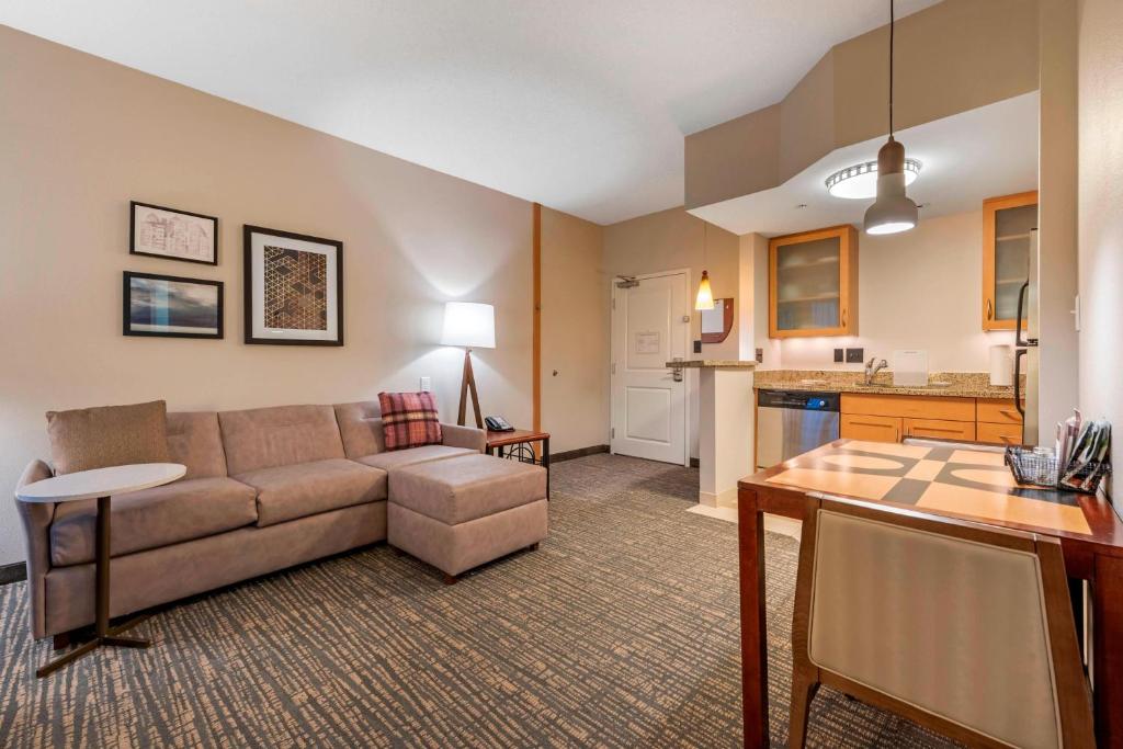 a living room with a couch and a table at Residence Inn Columbus in Columbus