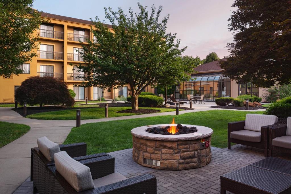 a fire pit in a courtyard in front of a building at Courtyard by Marriott Fishkill in Fishkill