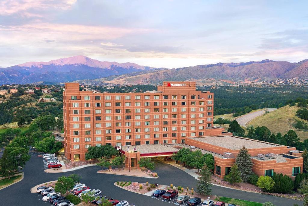 an aerial view of a building with a parking lot at Colorado Springs Marriott in Colorado Springs