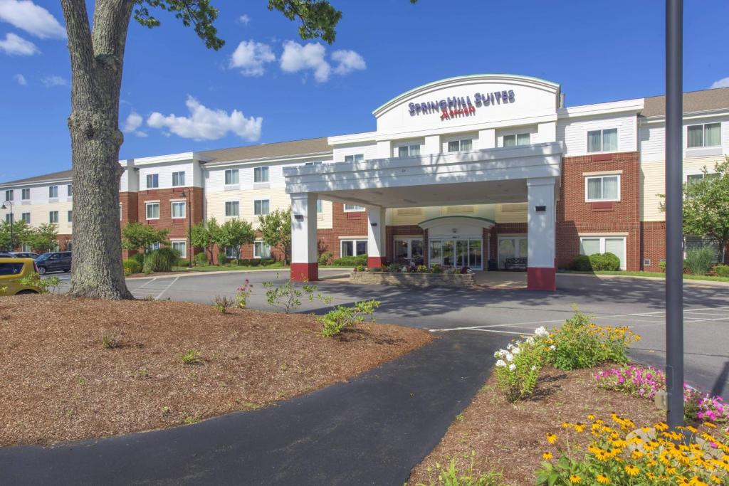 a hospital building with a sign in front of it at SpringHill Suites Devens Common Center in Devens