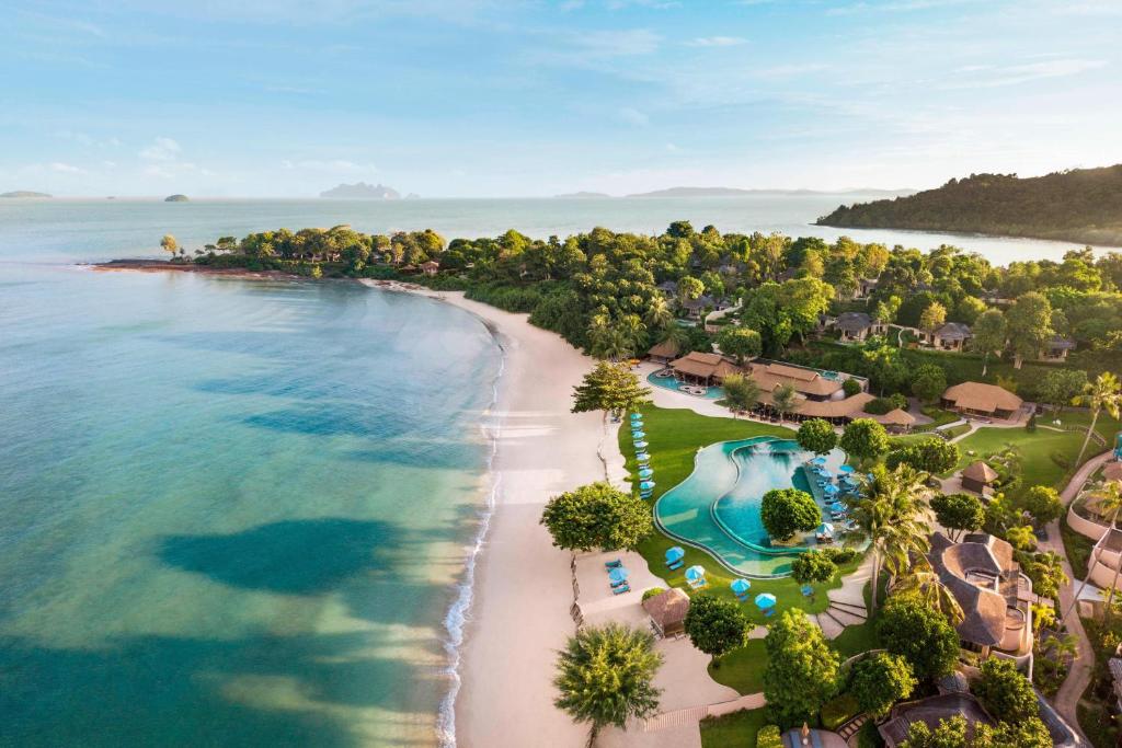 an aerial view of the beach at a resort at The Naka Island, a Luxury Collection Resort & Spa, Phuket in Ko Naka