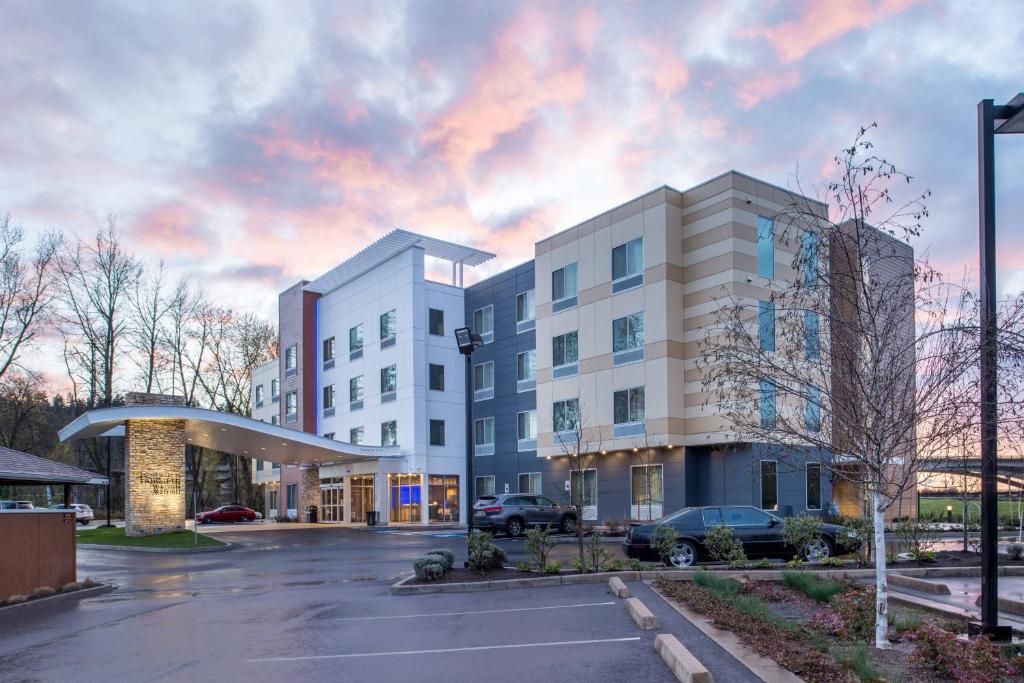 a rendering of a building in a parking lot at Fairfield Inn & Suites by Marriott Eugene East/Springfield in Eugene