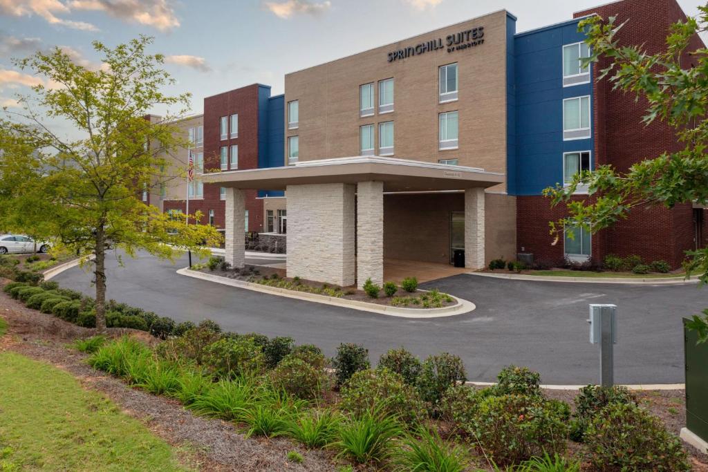 an image of the front of a hospital building at SpringHill Suites by Marriott Suwanee Johns Creek in Suwanee