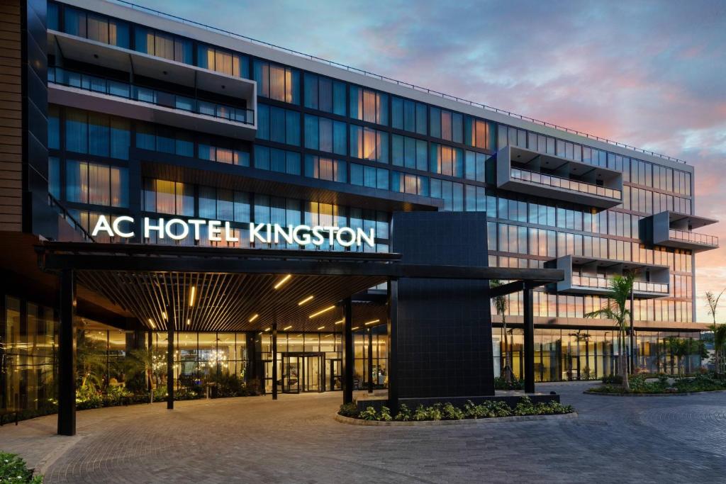 an office building with a sign that reads ac hotel kingdom at AC Hotel by Marriott Kingston, Jamaica in Kingston