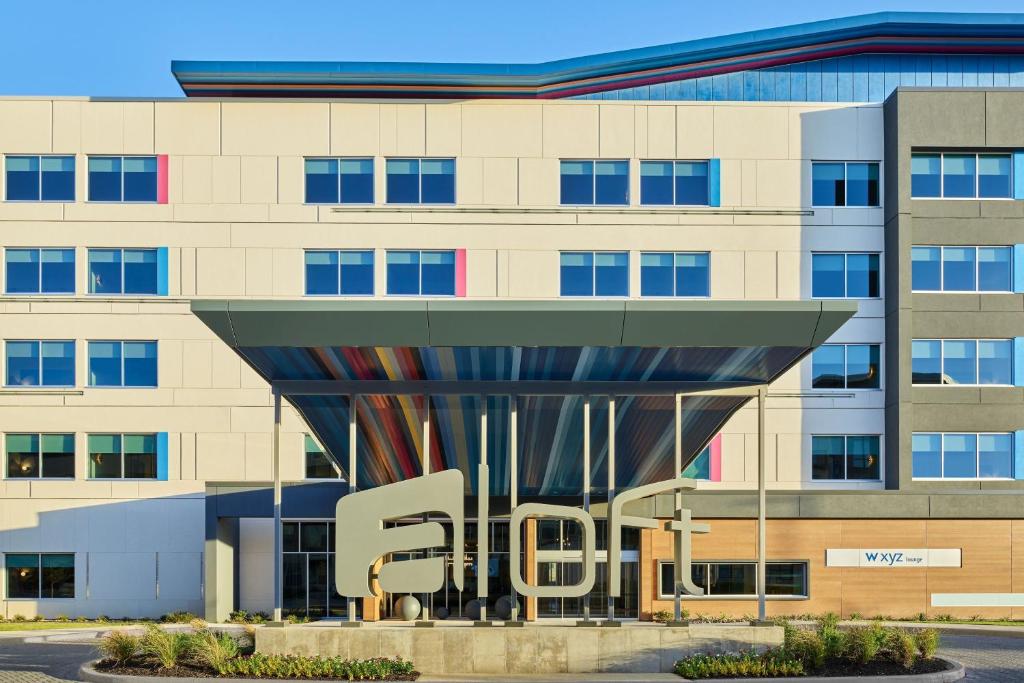 a building with the word city in front of it at Aloft Fort Worth Trophy Club in Trophy Club