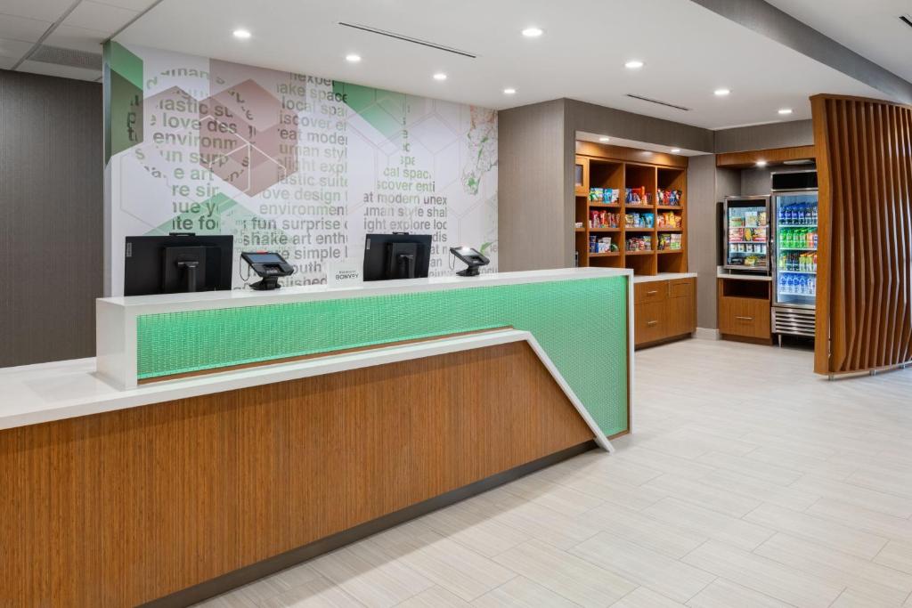 a lobby of a store with a cashier counter at SpringHill Suites by Marriott Weatherford Willow Park in Willow Park